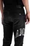 Amiri skinny jeans with varsity logo